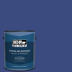 a blue paint can with the words behr ultra stain blocking paint and primer