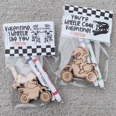 two markers and some stickers are on the ground next to each other, with an ad for valentine's day written on them