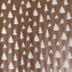 a brown background with white trees on it