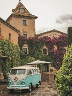 an old vw bus parked in front of a house