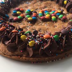 a cake with chocolate frosting and sprinkles