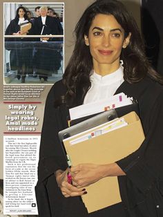 a woman holding files and folders in front of a newspaper article about her work