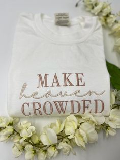 MAKE HEAVEN CROWDED Embroidered white Comfort Colors T-shirt,  embroidery t-shirts, Christian apparel, Christian Tshirt, Embroidered Christian tee 🎈WELCOME TO LoveStitchesCo If you are looking for soft, comfy, first-rate t-shirts, you're in the right place! Here at LoveStitchesCo, we love what we do and strive to make your shopping experience just right for you. If you have any questions, concerns, or comments about our products, feel free to shoot us a message anytime. Even on weekends and holidays, we'll try our best to respond as quickly as possible! 🎈 Embroidered Area Details - The design will be embroidered on a 7''x3.5'' area. 🎈Product Details Unisex T-Shirt: - Comfort Colors Brand - 100% cotton - Light/medium weight and extremely soft, this shirt is sure to be your next favorite White Crew Neck T-shirt With Floral Embroidery, White Embroidered Crew Neck T-shirt, White Letter Embroidery T-shirt For Spring, White T-shirt With Letter Embroidery For Spring, White T-shirt With Machine Embroidery, Short Sleeve, White T-shirt With Embroidered Logo For Spring, White Embroidered T-shirt For Spring, White Crew Neck Tops With Machine Embroidery, White Embroidered Text T-shirt For Spring