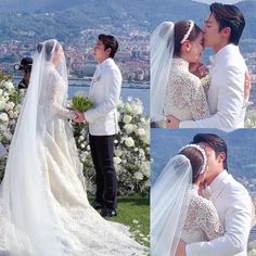 the bride and groom are kissing in front of their wedding party on top of a hill