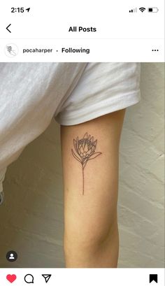 a woman's leg with a flower tattoo on it