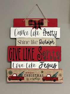 a christmas sign hanging on the wall