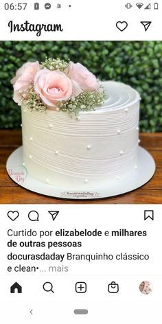 a white cake sitting on top of a wooden table