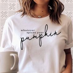 Who Else Loves A Good Pumpkin Spice Latte? This Whatever Spices Your Pumpkin Graphic Is The Perfect Top For This Upcoming Fall, It Features A White Background With Black Lettering. Bust Lying Flat: S-18.5in, M-20in, L-22in Length Lying Flat: S-24.5in, M-26.5in, L-28.5in Material: 100% Cotton White Tops With Text Print For Fall, White Text Print Tops For Fall, Simple White Top With Text Print, Simple White Tops With Text Print, Basic White T-shirt For Fall, Pumpkin Graphic, Best Pumpkin, Fall Tee, Pumpkin Spice Latte