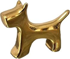 a golden dog shaped object on a white background