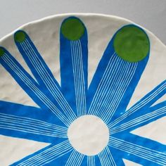 a plate with blue and green designs on it