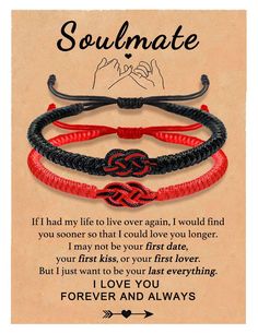 two red and black bracelets with the words soulmate written on it, in front of