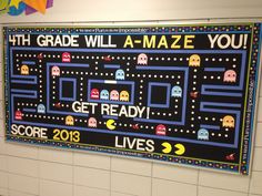 a bulletin board with an image of pacman and other video game characters on it