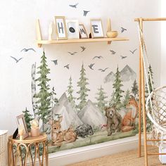 a wall mural with animals and birds in the woods on it's side, next to a wooden shelf