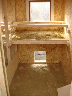 the inside of a chicken coop that is being built