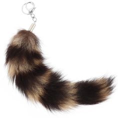 a furry animal tail is hanging from a keychain