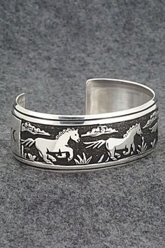 This sterling silver bracelet featuring a three galloping horses in a Southwestern landscape was made by Navajo silversmith Rosita Singer. The back is signed T&R Singer and stamped sterling.Size: 5 1/2" (will fit a 6 7/8" wrist)Gap: 1 3/8"Width: 1"Free shipping on all orders! We ship with USPS and always include tracking. All orders ship within a day of payment.Returns are accepted up to 30 days after you receive your order. Just send us a message. Our shop offers cash back or store credit. The Silver Horse Design Bracelet Jewelry, Silver Horse Design Jewelry Bracelet, Silver Bracelet With Inlay For Collectors, Collectible Silver Horse Design Jewelry, Silver Engraved Western Cuff Bracelet, Silver Western Cuff Bracelet, Engraved Silver Western Cuff Bracelet, Silver Western Style Bracelet, Western Style Silver Bracelet For Gift