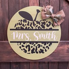 a wooden sign that says mrs smith with an apple on it and leopard print ribbon