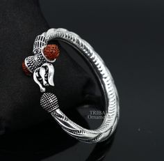 Amazing style handmade design 925 sterling silver customized bahubali bangle bracelet kada, lord Shiva Trishul or trident bangle kada with Rudraksh, best gifting silver jewelry from india. Metal-925 sterling silver. Item type- Shiva bangle kada, Width-10 mm approx. Weight -40.930 grams. Size-2-4 or 2.375 inches or 2.25 centimeter inner diameter (wear by twisting both face of bangle) Size-2-6 or 2.375 inches or 6.0 centimeter inner diameter (wear by twisting both face of bangle) Size-2-8 or 2.375 inches or 6.4 centimeter inner diameter (wear by twisting both face of bangle) Stamped-925. Condition-Brand new with oxidized. makes excellent gifting for birthday gift, wedding gift, anniversary gift, Christmas day gift, mother's day gift, brother's day gift, labor day gift, father's day. festival Adjustable Silver Jewelry For Puja, Silver Bracelets For Navratri, Silver Bangle For Puja, Handmade Silver Bangle For Puja, Spiritual Silver Bracelets For Navratri, Silver Bangle Bracelets For Puja, Silver Bracelet For Navratri Rituals, Silver Bracelets For Navratri Rituals, Traditional Polished Bangle As A Gift