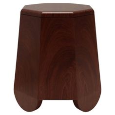 the wooden stool is made from wood and has a curved design on it's sides