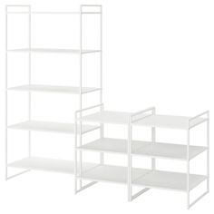 three white shelves are stacked on top of each other, and one shelf is empty