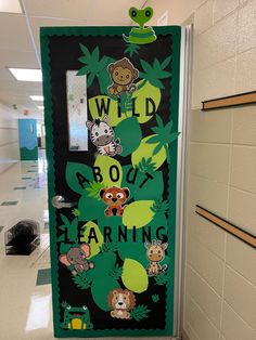 a classroom door decorated with animals and plants