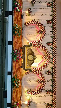 an elaborately decorated table with flowers and candles