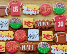 decorated cookies are arranged in the shape of american footballs and numbers, including one for each player