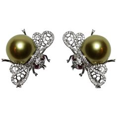 Two Elegant & Finely detailed vintage Bumble Bee pins, each set with approximately 0.3747ctw in G/VS diamonds, enhancing the wings and body, a 14.2mm Gold South Sea Pearl and two Ruby eyes; 18 Karat white gold; each pin measures approx. 29.7mm x 21.5mm and weighs approx. 8 grams. (May be purchased individually). Illuminate your look with these Classic Beauties...Family Heirloom Quality Keepsakes, to have and to hold Forever! Bee Pin, Bee Jewelry, Bee Brooch, Insect Jewelry, Gold Bee, Antique Brooches, Sea Pearl, Pearl Brooch, Sea Pearls