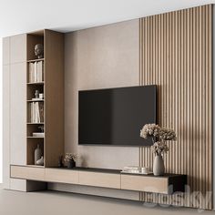 a living room with a large tv mounted on the wall and bookshelves next to it