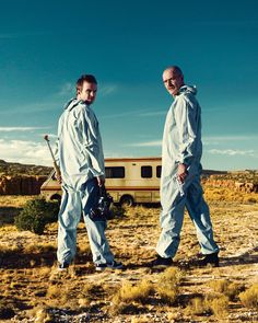 two men standing next to each other in front of a trailer with breaking bad written on it