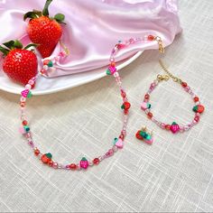 Handmade Pink “Strawberry Shortcake” Necklace, Bracelet, And Earrings Set. Necklace Is Approximately 18” Length. Bracelet Is Approximately 7” Length. Both Necklace And Bracelet Are Adjustable, As They Have An Extender. Crafted With 18kt Gold Plated Clasps And Nylon Coated, Stainless Steel Wire. Nickel Free. Check Out @The Serotonin Supply On Etsy & Link In Bio For More!