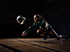 a female volleyball player in action on the court