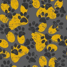 an animal print with yellow and black paw prints on grey background, which is very similar to the dog's paws