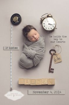 a baby is sleeping next to some keys and a clock