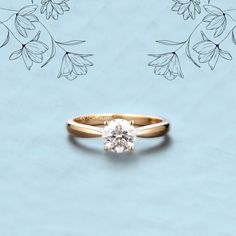 an engagement ring with a single diamond in the center on a blue background surrounded by flowers