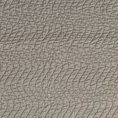 the texture of an upholstered wall with wavy lines