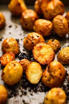 roasted potatoes on a baking sheet ready to be cooked