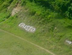 an aerial view of the word rio written in grass