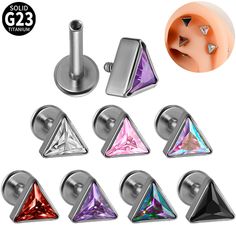 six pairs of triangle shaped studs with colored crystal stones on each one earring