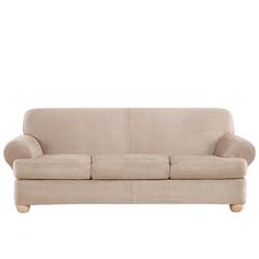 a beige couch sitting on top of a white floor