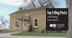 a small yellow house with a sign in front of it that says top 5 blog posts