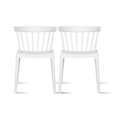 two white chairs sitting next to each other