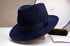 "Fedora | The DOYEN | Styled and finished by hand Customize it to match your physical characteristics and lifestyle. Personalize it to reflect your unique statement. At a glance: - Available in any color combination from our swatches - Tried and true handmade quality - Fits your exact head measurement comfortably - Delivered safely inside a real hat box - Includes a protective organic cotton drawstring bag - Comes with care instructions - Three delivery options Specifications: - Classic fedora h Blue Fedora Hat, Hat Outfit Men, Wide Brim Hat Men, Mens Dress Hats, Hat Outfits, Mens Fedora, Fedora Hat Men, Mens Fur, Fedora Hats