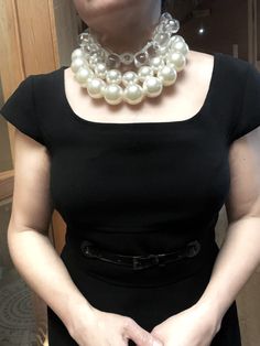 A set of 2 strands of medium-sized simulation pearls, with a separate choker necklace of one clear resin, tooth-shaped clear beads. You can wear the set or wear one or the other. The clear beads necklace contrasts the pearls' formality but also brings out the shine of the beads. The combination of styles is a unique statement for day or night. The necklace includes an extension to elongate both necklaces as a set or only one.

This item sells as a set.
The clear beads choker measures 16 IN/5 OZ.
The double-strand necklace measures 17 IN/ 10 OZ
Extension up to 5 IN
A set 16 IN/15 OZ Silver Plastic Jewelry For Party, Trendy Pearl Chain Choker For Party, Trendy Pearl Necklace For Party, Trendy White Pearl Necklace For Party, Plastic Beaded Jewelry For Party, Trendy Pearl Choker Necklace For Party, Elegant Plastic Jewelry For Parties, Layered Pearl Necklace, Beads Choker