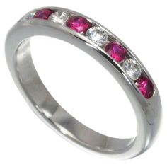 TIFFANY & Co. Platinum 3mm Half Circle Diamond Ruby Band Ring 4 Metal: Platinum Size: 4 Band Width: 3mm Diamond: 4 round brilliant diamonds, total carat weight .18 Ruby: 5 round rubies, total carat weight .20 Hallmark: TIFFANY&Co. PT950 Condition: Excellent condition, like new, comes with Tiffany box Limited edition, no longer available for sale in Tiffany stores Authenticity Guaranteed Ruby Band Ring, Tiffany Box, Ruby Bands, Circle Diamond, Half Circle, Tiffany And Co, Brilliant Diamond, Tiffany & Co., Round Brilliant