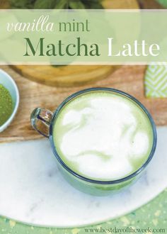 a cup of matcha latte on a white plate