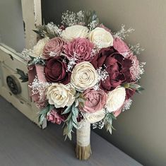 a bridal bouquet with pink and white flowers