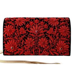 "Stunningly beautiful, opulent OOAK statement black velvet clutch hand embroidered with metallic cherry red flowers and embellished with genuine star rubies to create an opulent, 3D effect. This is an exclusive piece, a gorgeous wardrobe investment piece! The exquisite embroidery and the remarkable number of star rubies transforms this velvet clutch in to a TRUE statement piece! The best word to describe this purse is \"regal\". Hand embroidered in meticulous detail by the most skilled artisans Clutch Design, Embellished Purses, Best Word, Beautiful Wardrobe, Floral Clutches, Velvet Clutch, Wedding Purse, Ruby Beads, Girls Handbags