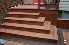 a wooden deck with steps leading up to it