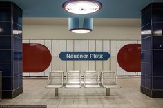 an empty waiting area with two chairs and a sign that says naaner plaza